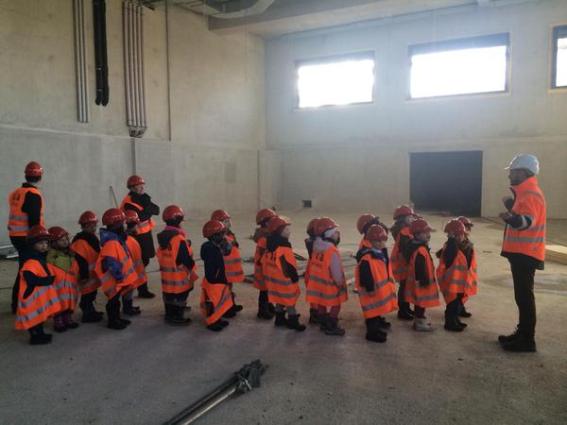 Kids getting a tour of a tech factory recreates Minions