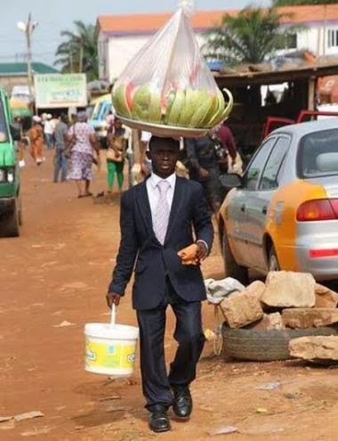 Funny: Ghanaian man on suit sells Watermelon