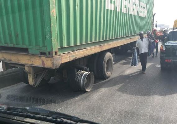 Truck running on burst wheel in Lagos