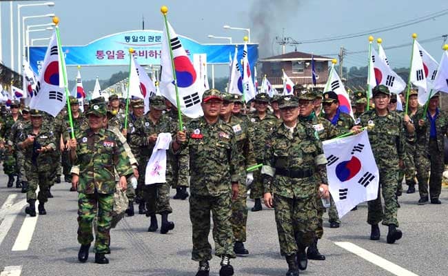 Poll shows that most South Koreans don't expect war with North, as Trump highlights military option