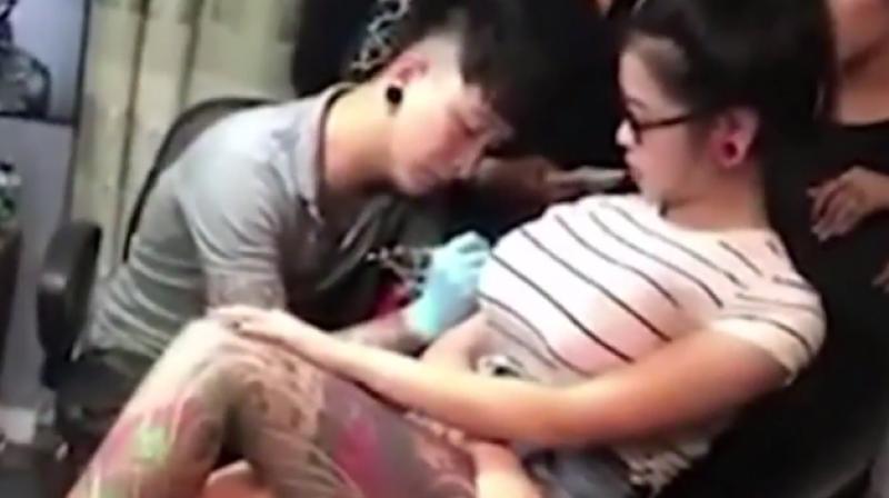 Woman's Breasts Burst While Having a Tattoo