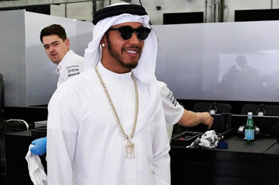 Driver Lewis Hamilton slays in  traditional Bahraini dress as he arrives for Grand Prix
