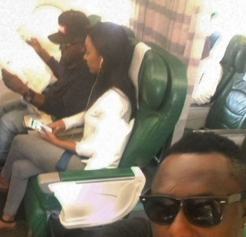 YQ shares a photo of himself in a plane with Ice Prince and his girlfriend Maima