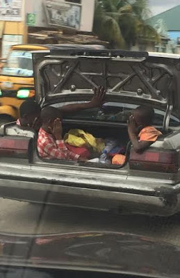Port Harcourt parent stuff children in car booth