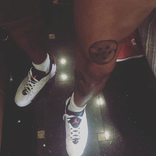 Chris Brown has some weird tattoos on his legs too