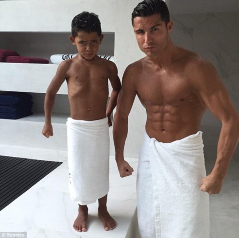 Cristiano Ronaldo and 5 year old son flex their muscles