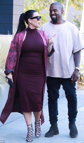 Pregnant Kim makes Kanye smile as they go shopping
