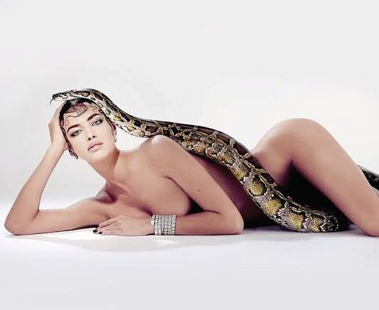 Irina Shayk strikes a wicked pose with a snake