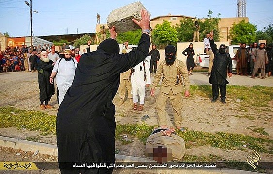 ISIS are on it again, smashes concrete block on a victim's head