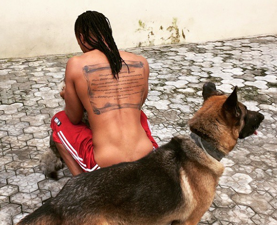 Flavour N'abania shares picture with scroll tattoo