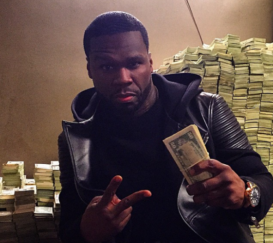 50 Cent still got a little pocket money with stacks of cash behind
