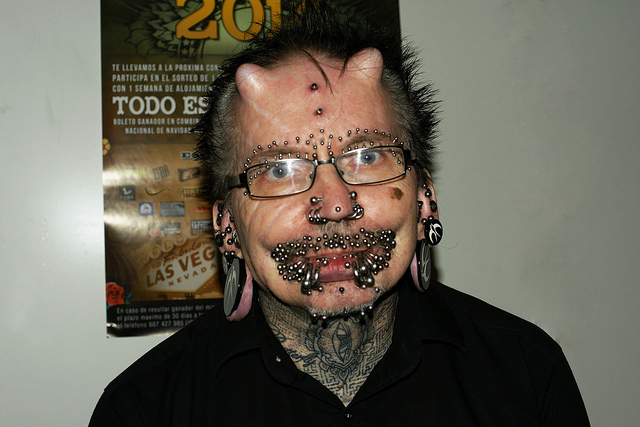 Rolf Buchholz, 53, has 453 piercings as well astwo horn implants on his forehead.