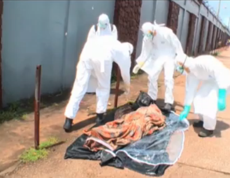 Photo: See incredible moment funeral workers realise 'dead' Ebola victim is alive